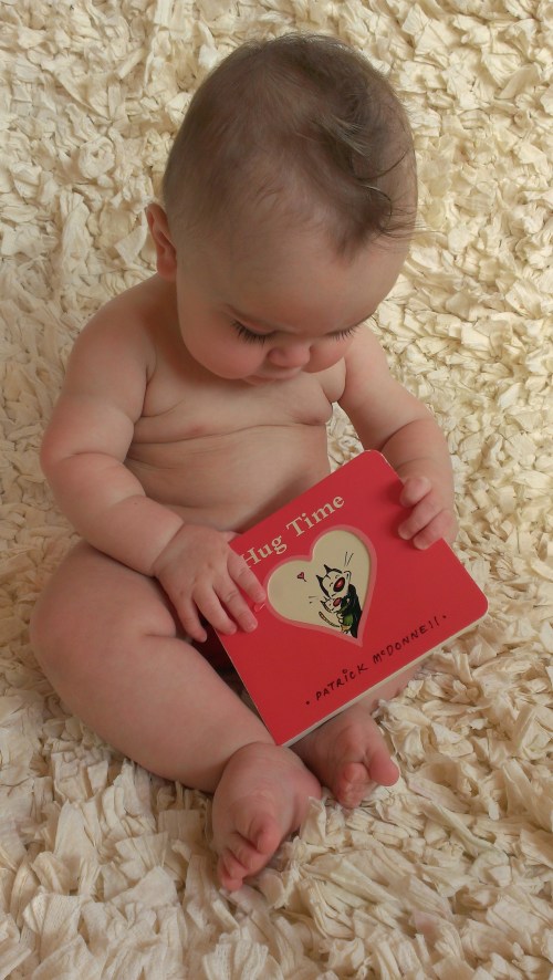 Belly rolls. Hug Time book from Pa and Mimi is a favorite.